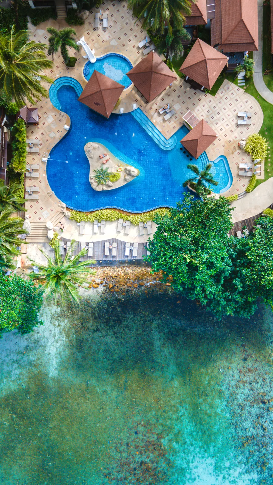 Representative aerial view of a tropical island resort and beach