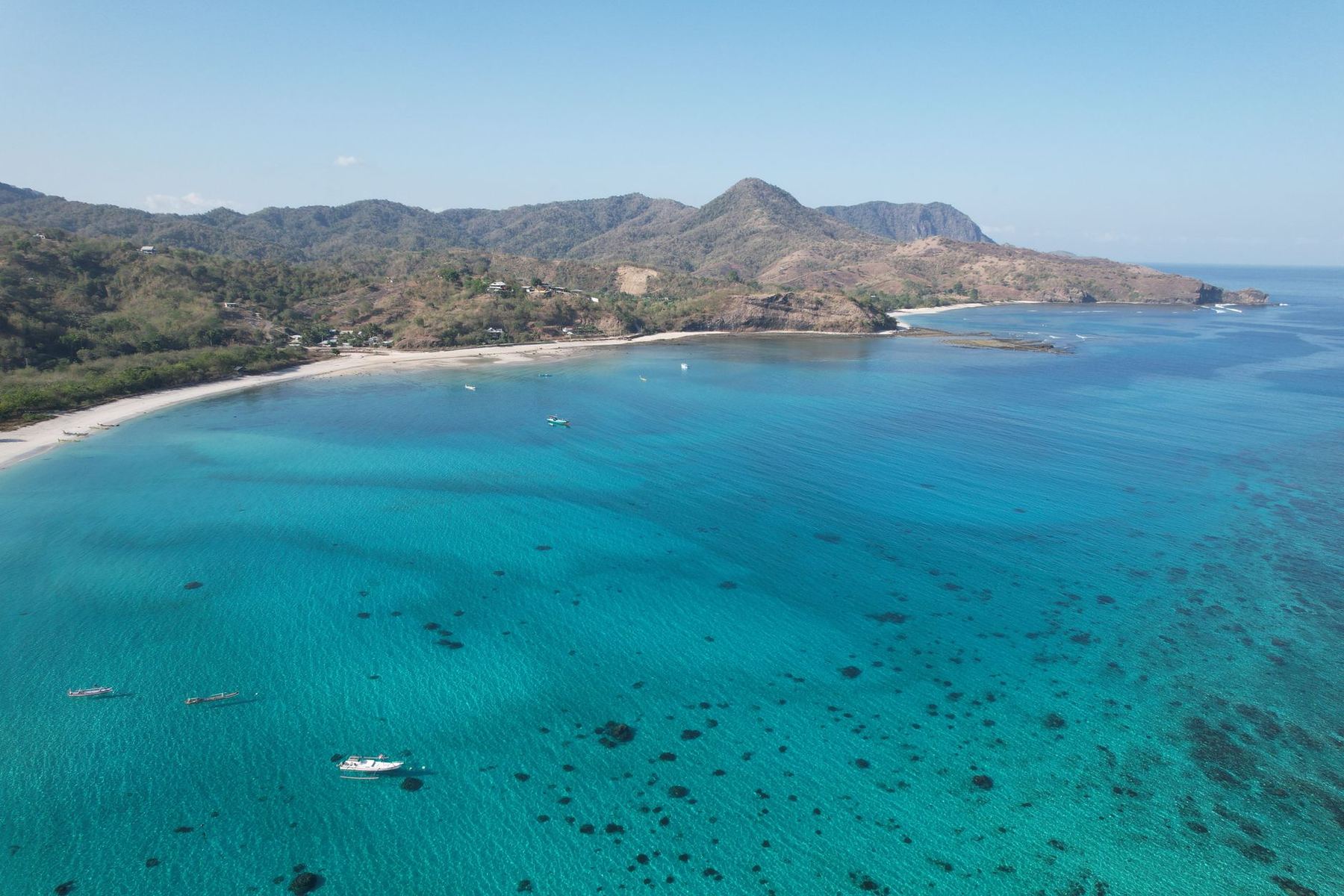 Clear turquoise water along the Lombok coast, seen from the air